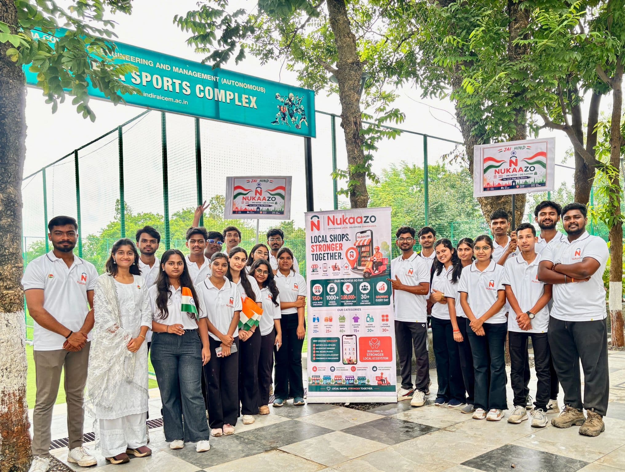 The Nukaazo team beside a banner showing 150+ local shops and 1,000+ orders delivered